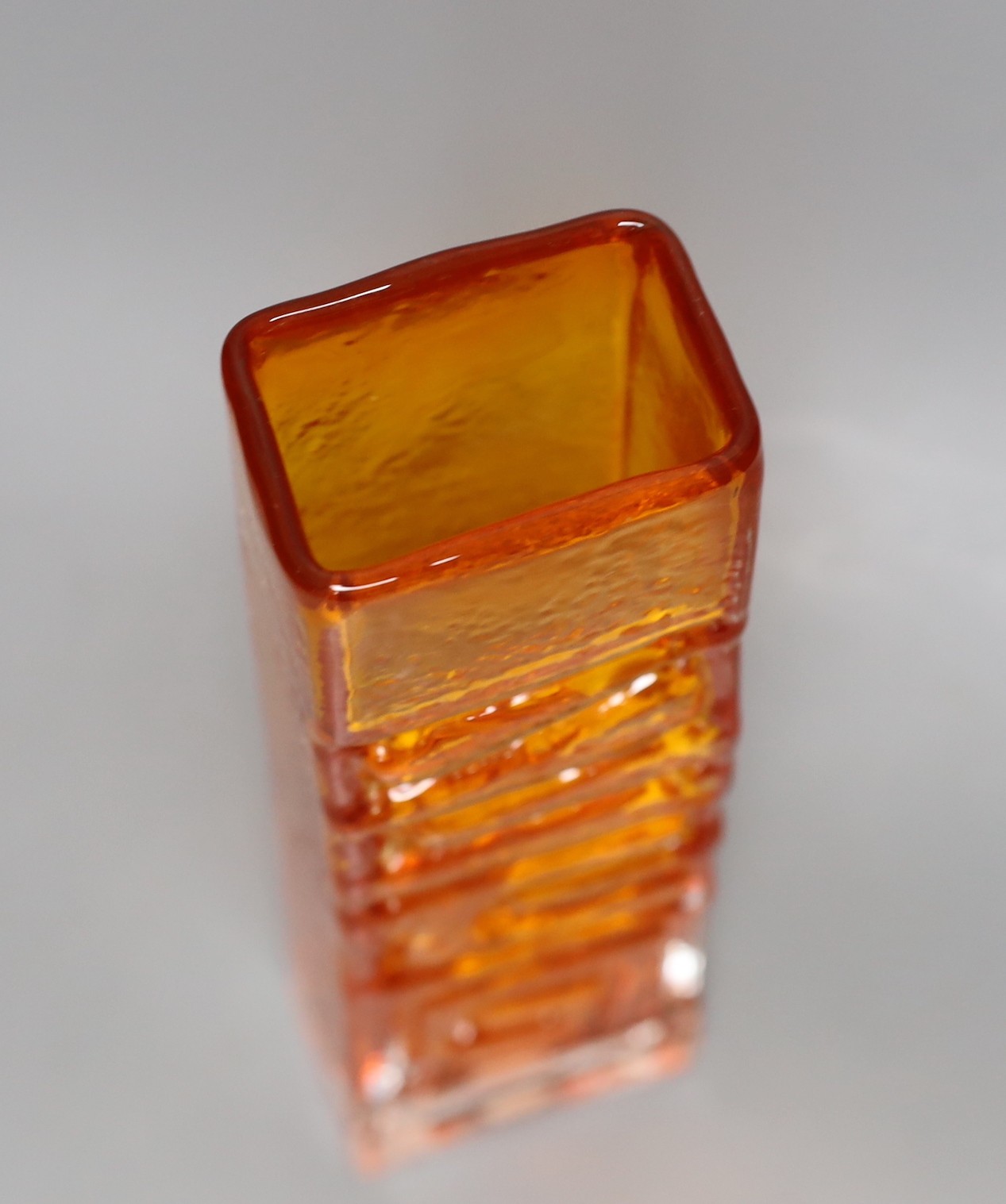 A Whitefriars 'Totem Pole' glass vase, designed by Geoffrey Baxter, pattern number 9671, tangerine glass, 27cm tall